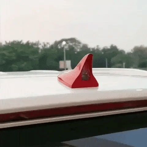 LED shark fin antenna mounted on black car