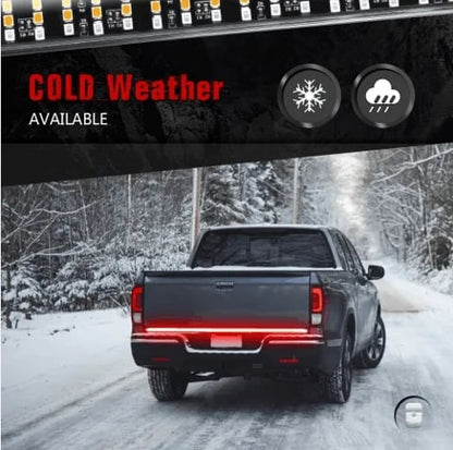 Truck driving safely in snow with SecureLite LED tailgate light bar – winter safety upgrade